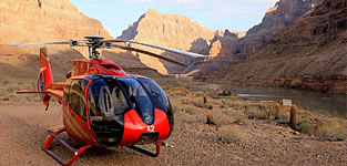 Luxury jet helicopter at the bottom of the Grand Canyon by the banks of the Colorado River