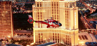 VIP luxury helicopter night flight above the Las Vegas Strip with the Venetian Hotel Casino in the background